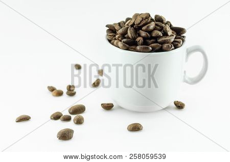 Coffee Bean - Small Cup Full Of Coffee Bean Isolated On White.