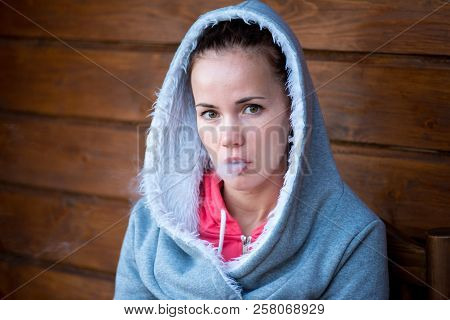 Sensual Young Girl Vaping Hookah Shisha Sitting On Terrace In Hotel. Vacation Rest. Lifestyle Withou