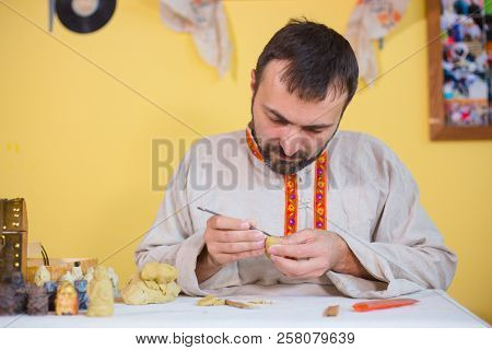Potter Making Clay Figure For Board Game