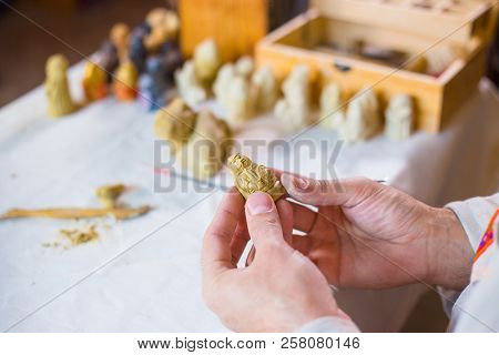 Potter Making Clay Figure For Board Game