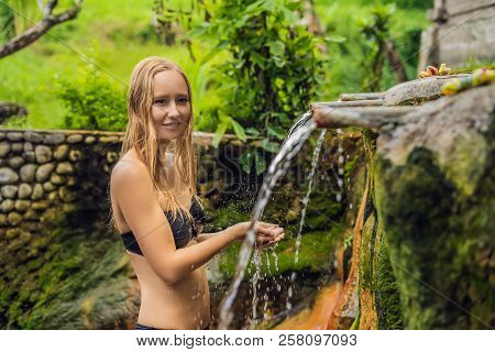 Young Woman Tourist In Belulang Hot Springs In Bali On The Background Of Rice Terraces