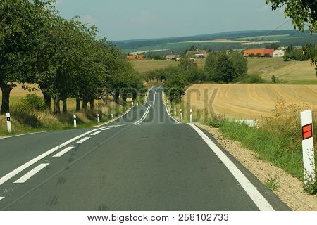 Roads Running Down The Hills Along The Fields And Trees.a Path Leading Down To The Village, Photogra