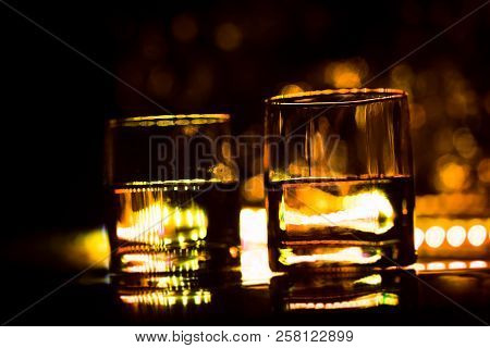Colored Lighting Of Glasses In The Night Club Bar