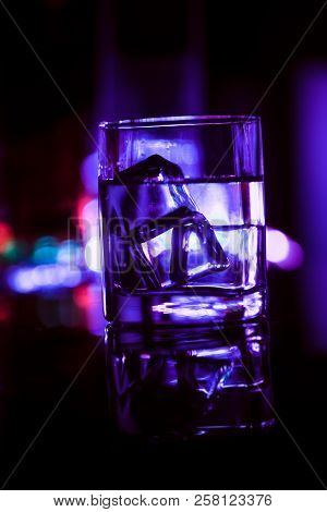 Colored Lighting Of Glasses In The Night Club Bar
