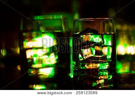Colored Lighting Of Glasses In The Night Club Bar