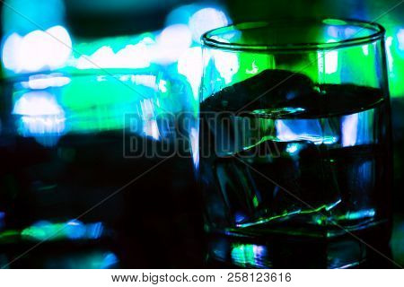 Colored Lighting Of Glasses In The Night Club Bar