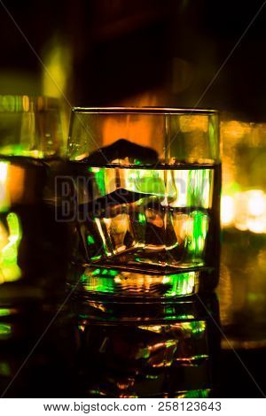 Colored Lighting Of Glasses In The Night Club Bar