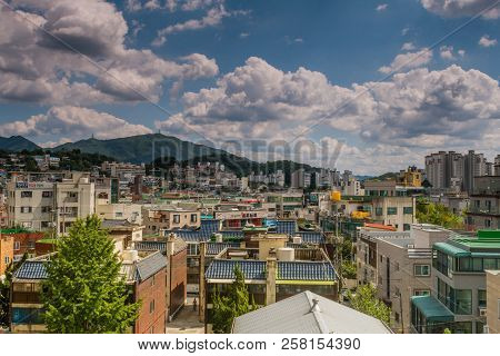 September 5, 2018; Daejeon, South Korea: Blue Sky With Puffy White Clouds Lingering Over Rooftops Of