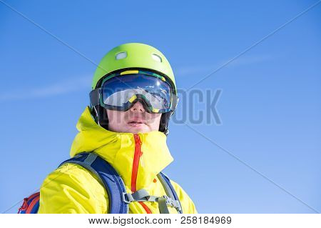 Photo Of Sporty Man Wearing Mask And Helmet Against Blue Sky During Day