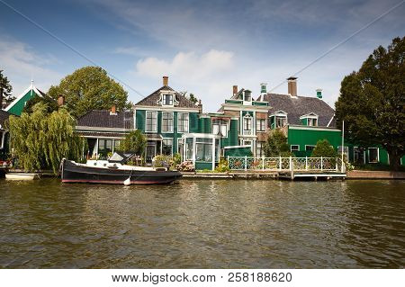 Traditional, Authentic Dutch Houses And Boat At The Canal.