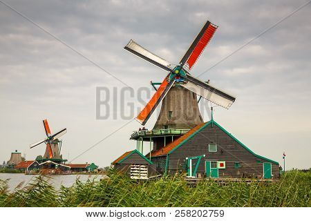 Zaanse Schans, Netherlands, August 19, 2015 - Traditional, Authentic Dutch Windmills At The River Za