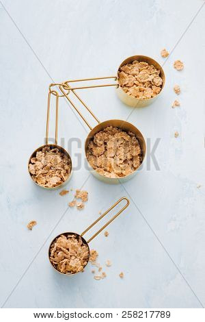 Ingredients In Measuring Cups And In Measuring Spoons With Rolled Oats