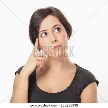 Thoughtful Beautiful Brunette Woman Portrait On White Background