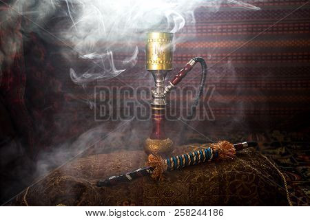 Hookah Hot Coals On Shisha Bowl Making Clouds Of Steam At Arabian Interior. Oriental Ornament On The