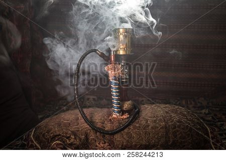 Hookah Hot Coals On Shisha Bowl Making Clouds Of Steam At Arabian Interior. Oriental Ornament On The