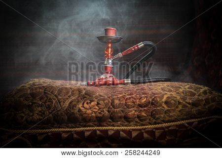 Hookah Hot Coals On Shisha Bowl Making Clouds Of Steam At Arabian Interior. Oriental Ornament On The