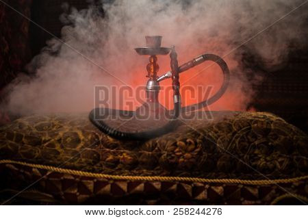 Hookah Hot Coals On Shisha Bowl Making Clouds Of Steam At Arabian Interior. Oriental Ornament On The