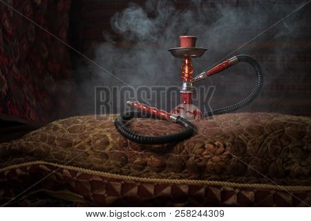 Hookah Hot Coals On Shisha Bowl Making Clouds Of Steam At Arabian Interior. Oriental Ornament On The