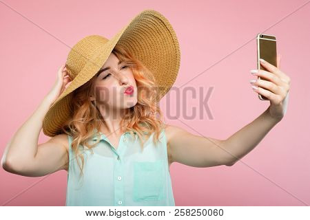 Stylish Social Network Influencer Taking A Selfie On Mobile Phone. Fashion Blogger Posting A Review 