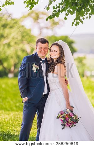 Marriage Concept. Bride And Groom Kissing Outdoor. Newlyweds Couple In Love. Wedding Couple In Love 