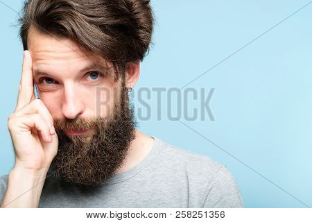 Intelligence And Smart Ideas Concept. Mind Games And Brain Power. Smug Confident Bearded Man Portrai