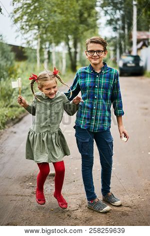 Funny Jumping Girl With Red Tights Tress Calm Boy Green Shirt