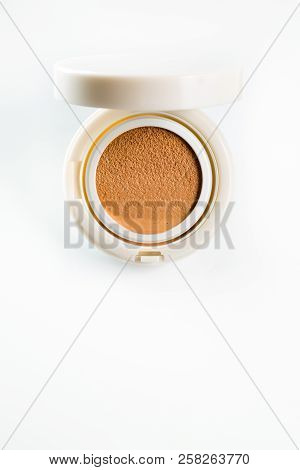 Foundation Cushion With A Tonal Base Pouring Out Of Puff