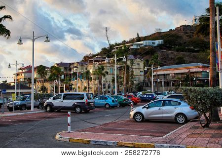 MARIGOT, ST.MARTIN - JULY 31, 2015: Parking lot with local shopong mall in  Marigot in Caribbean Island, St.Marten, 
