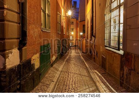 Old Medieval Street In The Night Illumination On The Island Gamla Stan. Stockholm. Sweden.