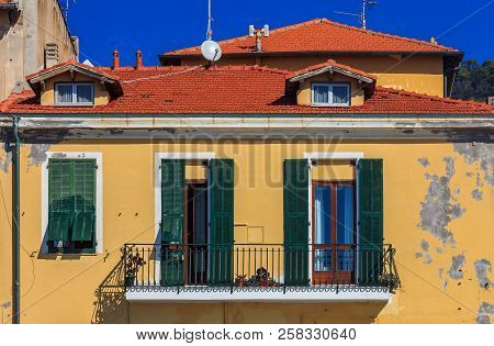 Facade Of An Old Building In Ventimiglia In Liguria Region Of Italy
