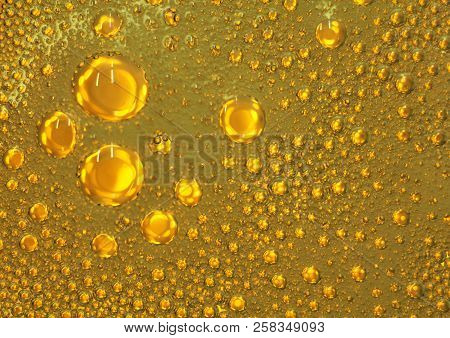 Cooking Oil, Water With Oil Emulsions And Bubbles In The Background.