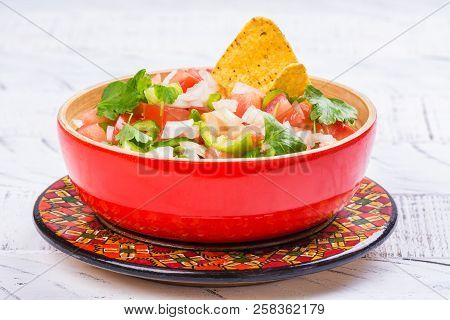 Bowl Of Fresh Mexican Pico De Gallo Salsa. Homemade Salsa With Crispy Corn Nachos Chips. Mexican Par