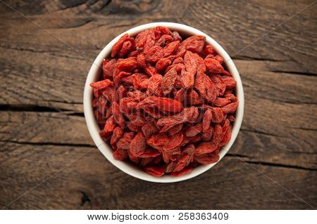 Dried Fruits Of Goji Berries Or Wolfberry On Rustic Wooden Table