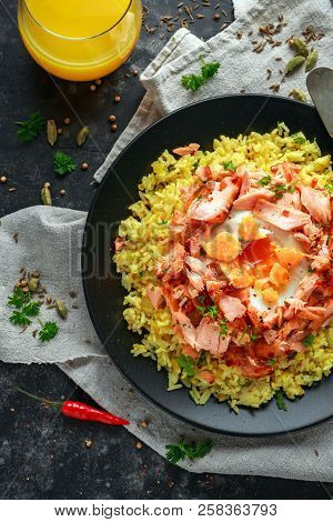 Traditional Indian-english Kedgeree Breakfast: Basmati Rice With Egg Benedict And Hot Smoked Sweet C