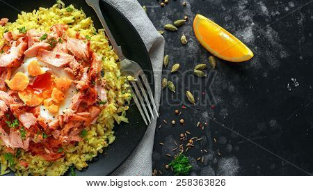 Traditional Indian-english Kedgeree Breakfast: Basmati Rice With Egg Benedict And Hot Smoked Sweet C