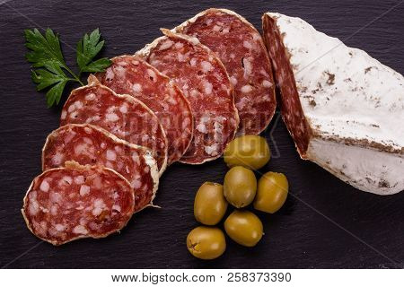 Saucisson Sec Delicious French Salami On A Wooden Background