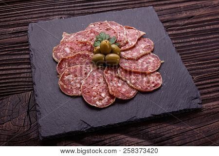 Saucisson Sec Delicious French Salami On A Wooden Background
