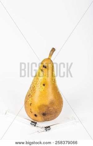 Close-up Boring Trace Of A Codling Moth Cydia Pomonella, In A Wormy Pear. On White Background. With 