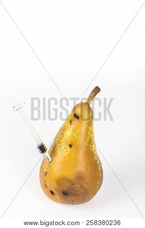 Close-up Boring Trace Of A Codling Moth Cydia Pomonella, In A Wormy Pear. On White Background. With 