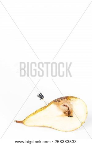 Close-up Boring Trace Of A Codling Moth Cydia Pomonella, In A Half Middle Wormy Pear. On White Backg