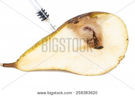 Close-up Boring Trace Of A Codling Moth Cydia Pomonella, In A Half Middle Wormy Pear. On White Backg