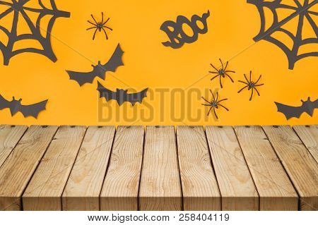 Empty Wooden Table Over Halloween Holiday Decorations Background