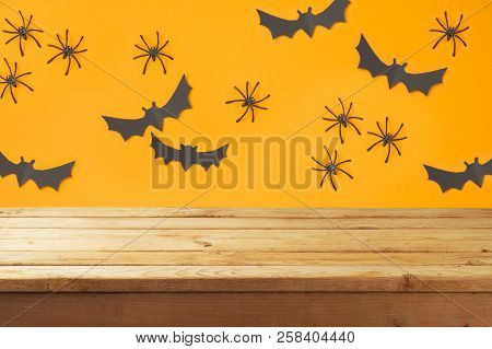 Empty Wooden Table Over Halloween Holiday Decorations Background
