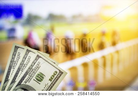 Money Dollars On The Background Of A Tv On Which Show Jumps On Horses, Sports Betting, Dollars, Race
