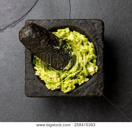 Guacamole Avocado Sauce In Stone Mortar. Top View