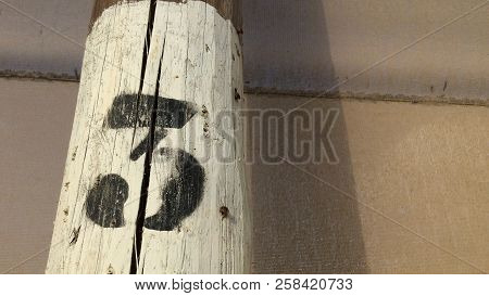 Number Three, Black Figure Three On A White Background, Number On A Pole, Dense Mesh As A Background