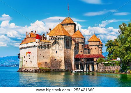 Scenic summer view of the old ancient medieval Chillon Castle on Geneva Lake near Montreux, Switzerland