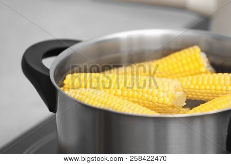 Stewpot With Water And Corn Cobs, Closeup