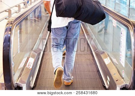 Men At Horizontal Escalator Covered. Moving Walkway, Moving Sidewalk, Moving Pavement, Autopedescala