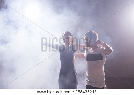 Young Couple Dancing Social Danse Kizomba Or Bachata Or Semba Or Taraxia In Dancing Class Background
